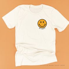 All Little Mama shirts are unisex sizing. They run slightly larger than typical women's shirts and slightly smaller than typical men's shirts. We recommend ordering your normal size for a regular fit.Please reference all size charts before purchasing.The default design color on this shirt is white, unless an option is given. Smiley Face Clothing, Smiley Face Yellow, Smiley Face Tee, Smiley Face Tshirt, Smiley Face Shirt, Happy Smiley Face, Tshirt Bag, White Crewneck, Mom Life Shirt