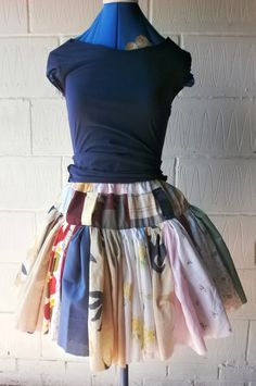 a dress on a mannequin with different colored fabrics