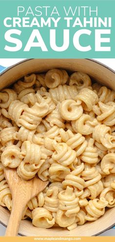 pasta with creamy tahitii sauce in a large pot on a blue and yellow background