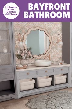 a bathroom with gray cabinets and a white bowl on the sink in front of a mirror