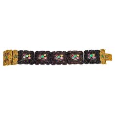 This extraordinary bracelet has been handcrafted around 1825. It is most likely the work of an english workshop. Five delicately carved wooden segments are threaded onto two gold chains and secured in an ornamental gold clasp. The clasp is set with three emeralds and five rubies. Each wooden element is decorated with a ruby, an emerald, a sapphire, a pink and yellow topaz. The precious stones are mounted in gold settings that are riveted onto the wood. This bracelet is very rare indeed. Ruby Emerald, Gold Wood, Mariah Carey, Link Bracelets, Gold Chains, Precious Stones, Topaz, Jewelry Bracelets, Emerald