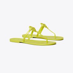 Our iconic collection, reimagined. Featuring a scaled-down double 'T', the Mini Miller Jelly Thong Sandal is durable and waterproof — perfect for the beach. Trendy Flat Jelly Sandals With Textured Footbed, Trendy Flat Textured Jelly Sandals, Spring Pool Sandals With Synthetic Material, Flat Synthetic Sandals For Poolside, Gold Flat Jelly Sandals, Gold Jelly Sandals For Beach, Tory Burch Jelly Sandals, Tory Burch Sandals Sparkly, Tory Burch Miller Sandals Black