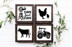 four farm signs mounted to a brick wall