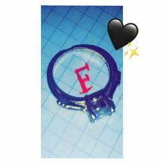 a magnifying glass with the letter e on it next to a black heart