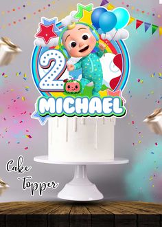 a birthday cake topper with the number two on it and balloons in the background