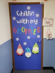 a door decorated with gnomes and snowflakes in the hallway for children to use