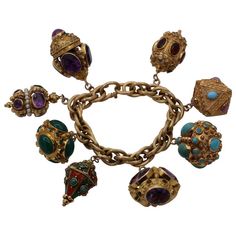 Gold Midcentury Charm Bracelet with Enamel and Assorted Stones | See more rare vintage Charm Bracelets at https://www.1stdibs.com/jewelry/bracelets/<null> White Gold Charm Bracelet, Basic Bracelet, Cartier Gold, Gold Link Bracelet, Jewellery Marketing, Gold Charm Bracelet, Types Of Gemstones, Yellow Gold Bracelet