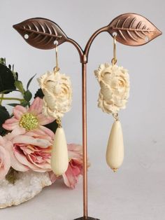 Pendant earrings with ivory paste drops imitation and cameo flowers in ivory paste handmade in Torre del Greco depicting flowers, 2.5 cm size, monachelle closure in 925 silver. total length 8 cm. Elegant Beige Flower Earrings Gift, Elegant Beige Flower Earrings For Gift, Elegant Cream Flower Earrings, Elegant Cream Flower Earrings For Gift, Elegant Beige Teardrop Earrings, Red Coral Earrings, Red Coral Necklace, Drop Earrings Silver, Cameo Earrings