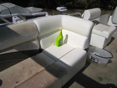 a bottle of cleaner sitting on the back of a boat