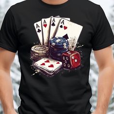 a man wearing a black t - shirt with playing cards and dices on it