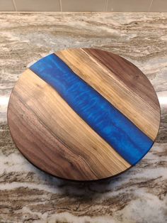 a wooden plate sitting on top of a marble counter