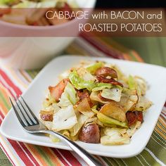 cabbage with bacon and roasted potatoes on a white plate next to a bowl of salad