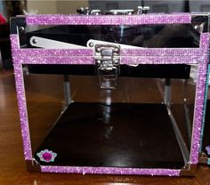 "Rhinestone purple covered crown box (AB stones also available see other listings). Outer dimensions: 9\" wide x 9\" long x 8.25\" tall Inner dimensions: 8.75\" wide x 8.75\" long Height under tray when closed: 6\" deep Tray dimensions: 7.5\" wide x 8\" long x 1.75\" deep Beautifully stoned crown box that will catch everyone's eye. Show off your crown and sash! Includes black pull-out sash tray and a black removable pillow/insert (1/2\" foam). Comfort handle and clasp lock closure. Fits crowns o Travel Display, Queen Tiara, Queens Tiaras, Rose Gold Crown, Pageant Crowns, Train Case, Purple Rhinestone, Gold Crown, Velcro Straps