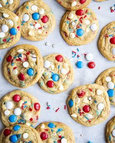 cookies with red, white and blue sprinkles are arranged on a baking sheet