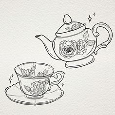 two teapots with flowers on them and one has a saucer in it