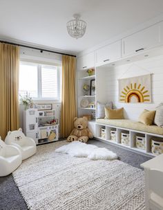 a child's room with white furniture and yellow curtains