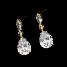 Add a touch of elegance to any outfit with our Gold Crystal Cubic Zirconia Teardrop Earrings. Featuring stunning cubic zirconia crystals and a radiant gold framework, these earrings exude timeless beauty and grace. Perfect for any occasion. Classic Gold Teardrop Earrings With Diamond Accents, Gold Teardrop Cubic Zirconia Earrings For Formal Occasions, Classic Gold Teardrop Cubic Zirconia Earrings, Formal Gold Cubic Zirconia Teardrop Earrings, Gold Pear-shaped Cubic Zirconia Bridal Earrings, Fashion Jewelry Earrings, Teardrop Earrings, Timeless Beauty, Cubic Zirconia