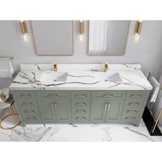 a bathroom vanity with two sinks and mirrors