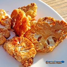 some fried food is on a white plate and it looks like they have been eaten