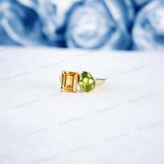 Emerald Cut Citrine Promise Ring Delicate Women Wedding Ring 14k Solid Gold Personalized Jewelry Vintage Peridot Statement Ring Gift For Her The intricate design of this statement ring showcases the beauty of the peridot stone, making it a unique addition to any jewelry collection. Crafted with delicate details, this vintage peridot promise ring is a beautiful gift for her to cherish. Gemstone Details :- - Gemstone: Citrine - Stone Type: Lab Created - Shape: Emerald Cut - Size: 8x6 MM - Color: Yellow - Luster: Excellent - Make: High Quality - Stone Type: Peridot ( Lab Created ) - Shape: Pear Cut - Size: 7x5 MM (Each Stone) - Color: Green - Luster: Excellent Types Of Gemstones :- - There is a wide selection of over 20 different gemstones to choose from :- - Blue Sapphire - Red Ruby - Green Yellow Peridot Wedding Rings, Yellow Peridot Wedding Jewelry, Citrine Promise Ring, Women Wedding Ring, Peridot Stone, Citrine Stone, Types Of Gemstones, Handcrafted Rings, Delicate Details