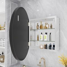 a bathroom with white marble walls and shelves filled with personal care items on the wall