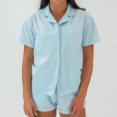 Indulge in the Motier Sofia Seersucker Button Down, the ultimate modern day cover-up. Wear it over your swimwear or as a stylish lounge piece. Whether you're out on the town, at the beach, or simply spending time with friends, this button down is an absolute must-have. 95% Polyester, 5% Spandex Motier Garment Washed Seersucker Fabric Four-Way Stretch Notched Collar Embroidered Motier logo Model Is 5'7 wearing a size small Spring Beachwear Tops For Lounging, Summer Cotton Sleepwear With Camp Collar, Summer Tops With Camp Collar For Loungewear, Summer Camp Collar Top For Loungewear, Summer Vacation Button-up Sleepwear, Summer Short Sleeve Lounging Top, Summer Button-up Loungewear Tops, Blue Tops For Relaxation In Summer, Cotton Beachwear Tops For Daywear