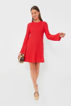 Sleek and chic, the Red Adi Knit Dress is exactly what your closet needs. A perfect not-too-dressy-not-too-casual piece, this fit and flare mini is suited for lunch dates, lowkey events, and whenever you want a pop of fun in your outfit rotation. Featuring ultra-wearable touches like a round neckline, long sleeves that get wider at the cuff, and a unique ribbed row texture, you'll be styling this knit number with boots, flats, and kitten heels all year long! Round neckline Long bell sleeves Keyh Red Fit And Flare Mini Dress, Chic Red Sweater Dress For Party, Elegant Red Sweater Dress For Party, Ribbed Mini Dress For Evening In Fall, Chic Red Mini Sweater Dress, Chic Ribbed A-line Dress, Chic A-line Ribbed Dress, Evening Ribbed Mini Sweater Dress, Chic Red Fitted Sweater Dress