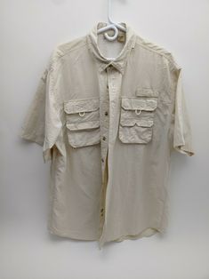 Rugged Earth Outfitters button up vented Fishing Shirt with extendable Collar. Good used condition. JL Missouri Parts has been selling on Ebay for well over a decade. We are constantly expanding the line of parts we offer. We are a small family run business NOTICE: We ship every weekday, expect a business day before your item is shipped. Everything is shipped with Tracking. If you have a problem with your purchase please contact us and we will do our best to resolve it. I use calculated shipping Vintage Khaki Top For Outdoor, Vintage Style Tops With Button Closure For Outdoor, Casual Fishing Shirt With Pockets, Shirt Short Sleeve, Small Family, Fishing Shirts, Selling On Ebay, The Line, Summer Outfit