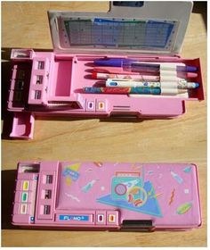 two pink pencils and pens in a case on a table