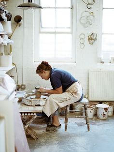 a woman sitting on a chair in a room