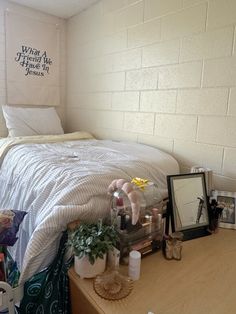 a small bedroom with a bed, desk and pictures on the wall above it that says when a friend me you're