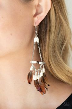 Infused with a wooden accent, an earthy assortment of white stone teardrop beads and dainty brown feathers create a free-spirited fringe at the bottom of a shimmery silver chain teardrop for a wildly wonderful finish. Earring attaches to a standard fishhook fitting. Paparazzi Accessories Jewelry, Feather Jewelry, Ball Necklace, Paparazzi Accessories, Teardrop Beads, White Rhinestone, Paparazzi Jewelry, White Earrings, Feather Earrings