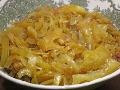 a bowl filled with cooked onions on top of a table