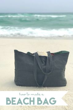 a tote bag sitting on top of a beach next to the ocean with text overlay that reads how to make a beach bag