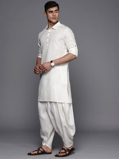 A timeless classic, this White Solid Linen Blend Pathani Kurta with Pyjamas is a sophisticated and practical addition to any wardrobe. Featuring a solid pattern, Pathani shape, and regular style, the shirt collar and long roll-up sleeves ensure comfort, while the calf-length with straight hem gives it a timeless look. The certified machine weave linen ensures a lightweight, breathable, and durable fabric, and the solid Pyjamas come with a partially elasticated waistband and slip-on closure for a