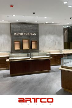 the interior of a jewelry store with counter tops and glass display cases on each side