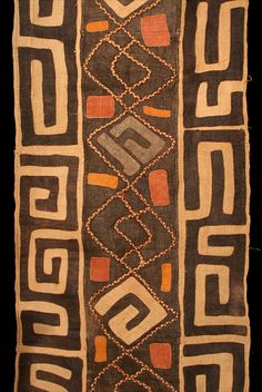 an old piece of cloth with designs on it