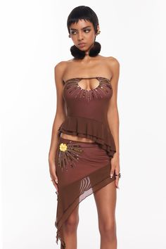 Fits true to size Brown mesh outer layer with a contrasting pink lining Embellished with sequin detailing that radiates from the center Keyhole cutout at the bust Fully lined Brown Halter Top Outfit, Halter Tops Outfit, Brown Halter Top, Coachella Fits, Coachella Outfits, Festival Fits, Skirts Outfits, Dance Festival, Coachella Outfit