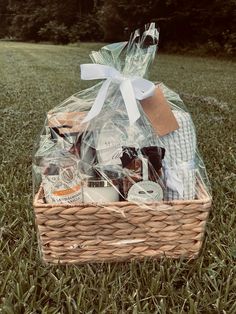 a picnic basket is sitting in the grass