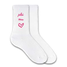 two pairs of white socks with the words delta delta written on one side and delta delta in