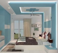 a bedroom with blue and white walls, carpeted flooring and a ceiling fan