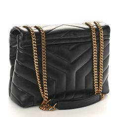 This is an authentic SAINT LAURENT Calfskin Y Quilted Monogram Small Loulou Chain Satchel in Black. This elegant shoulder bag is crafted of chevron-quilted calfskin leather. The bag features a gold chain link shoulder strap with shoulder pads, and a gold YSL detail on the crossover flap. The bag opens to a partitioned black fabric interior with zipper and patch pockets. Black Fabric, Shoulder Pads, Chain Link, Crossover, Gold Chain, Patch Pocket, Gold Chains, Calf Skin, Saint Laurent