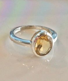 "All pieces are sent in a giftbox and placed in a netted, organza bag, ready for gift giving! 9x7mm Genuine Citrine rings set in Sterling Silver. 3.5 Grams approx. faceted These rings are handmade hand-set and on the rare occasion that they have a minor imperfection, you can always return for a full refund. No questions asked. Boho ring hippie ring birthstone ring The healing properties of CITRINE... The of Aries, Gemini, Leo and Libra can all see benefit from having, wearing or using the chakra Minimalist Topaz Birthstone Ring As Gift, Modern Topaz Birthstone Ring As Gift, Modern Topaz Ring As Birthstone Gift, Sterling Silver Topaz Ring With Bezel Setting As Gift, Minimalist Topaz Gift Ring, Citrine Birthstone Ring For Gift, Citrine Birthstone Rings As Gift, Adjustable Topaz Birthstone Ring Gift, Amber Birthstone Ring With Gemstone Details As Gift