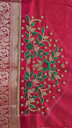 red and gold saree with green leaves on it