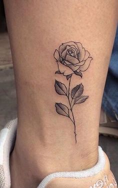 a small rose tattoo on the ankle