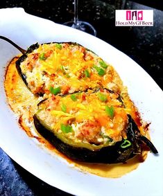 an eggplant stuffed with cheese on a white plate