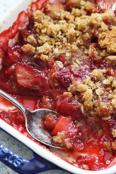 a close up of a dish of food with fruit and crumbled toppings