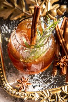 a drink with cinnamon and anise on a tray