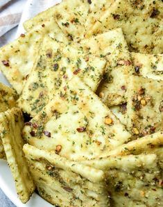 some food is on a white plate and has been cut into wedges to eat