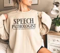 Subscribe and Save for exclusive discounts on our email list! Copy and paste this link into your browser: https://bit.ly/zandiscornerVIPCLUB  Show off your passion for speech therapy with our Coquette Speech Therapy Sweatshirt! This cute and funny SLP shirt is perfect for Speech Language Pathologists, Speech Therapy Assistants, or as a thoughtful therapist graduation gift. Whether you're an AAC enthusiast or a proud Speechie, this stylish therapy sweatshirt is a must-have for any language pathologist For a more generously oversized appearance, we recommend sizing up by 1 size from your usual size. To ensure the perfect fit for you, please refer to the product dimensions available in the photo section. Additionally, please be aware that there might be slight color variations due to the disp Speech Language Pathologist Gifts, Slp Shirts, Speech Therapy Shirts, Speech Pathologist, Gift For Graduation, Therapist Gifts, Speech Pathology, Speech Language Pathologists, Speech And Language